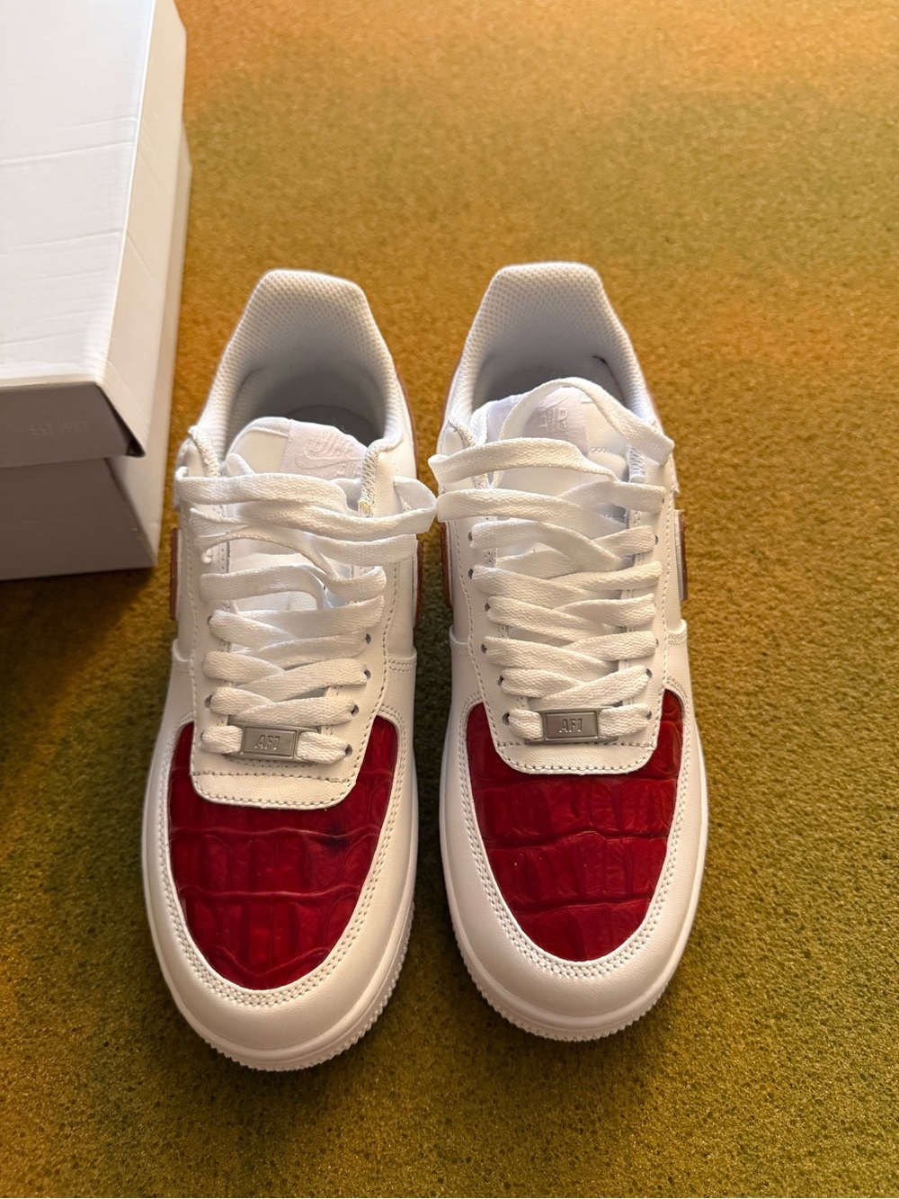 Nike White Sneakers with Red Toe Panels